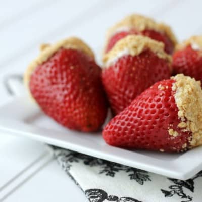 With only 5 ingredients, these cheesecake stuffed strawberries are a perfect dessert or party snack! This is a great recipe for kids to help with, too!