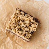 chocolate peanut butter oatmeal bar on brown paper