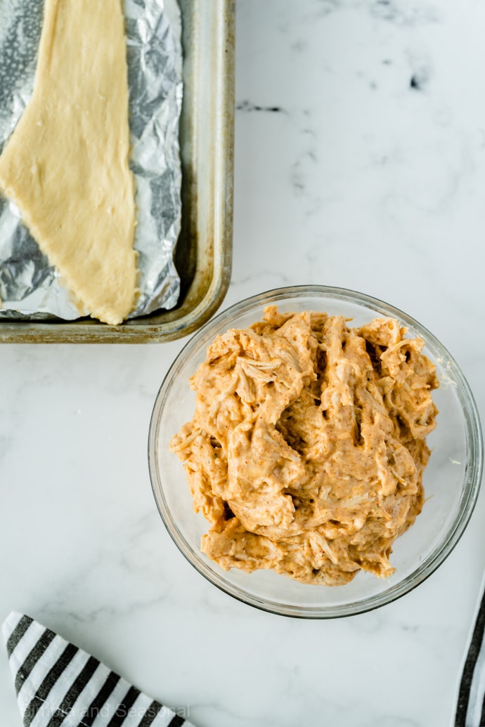 bowl of chicken filling for enchilada puffs