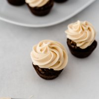 two brownie bites with icing on top