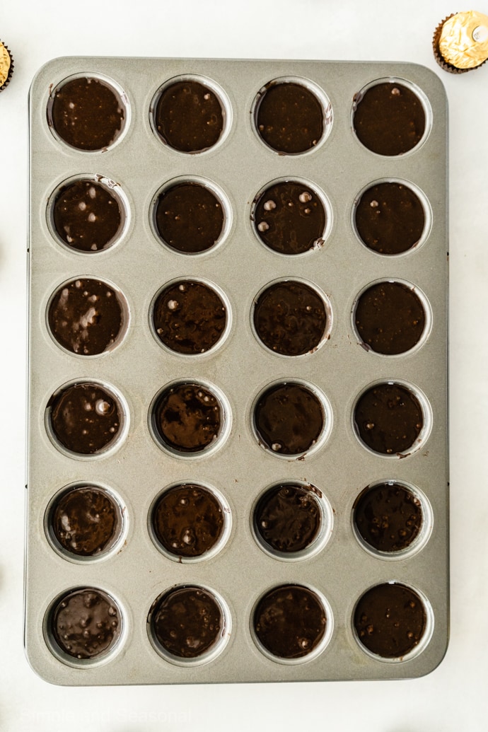 mini muffin pan with brownie batter 