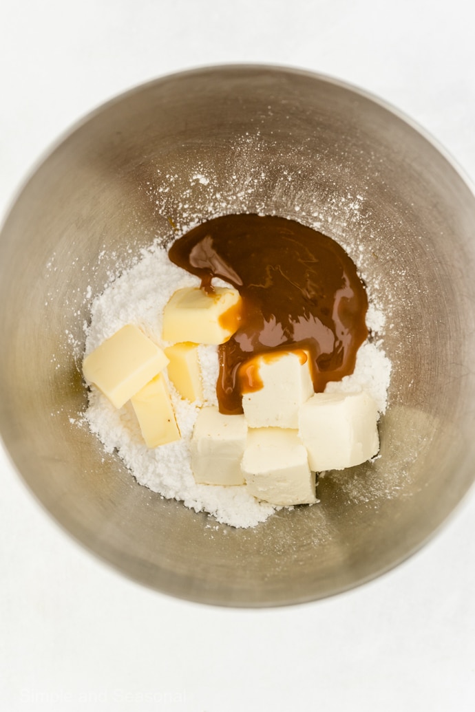 ingredients for caramel icing in a mixing bowl