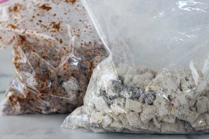 white chocolate mix in a gallon ziploc bag and milk chocolate mix in another gallon ziploc bag