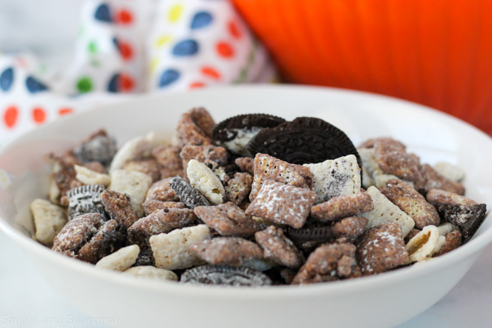 white bowl of cookies and cream chex mix ready to serve