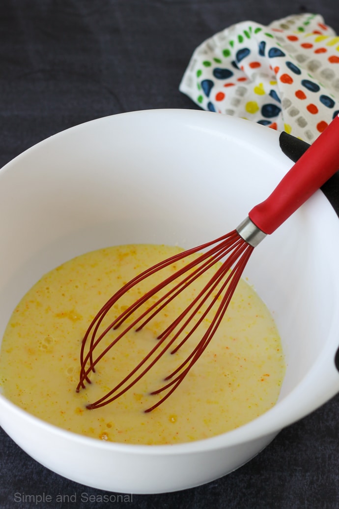 pudding mix being stirred with a whisk