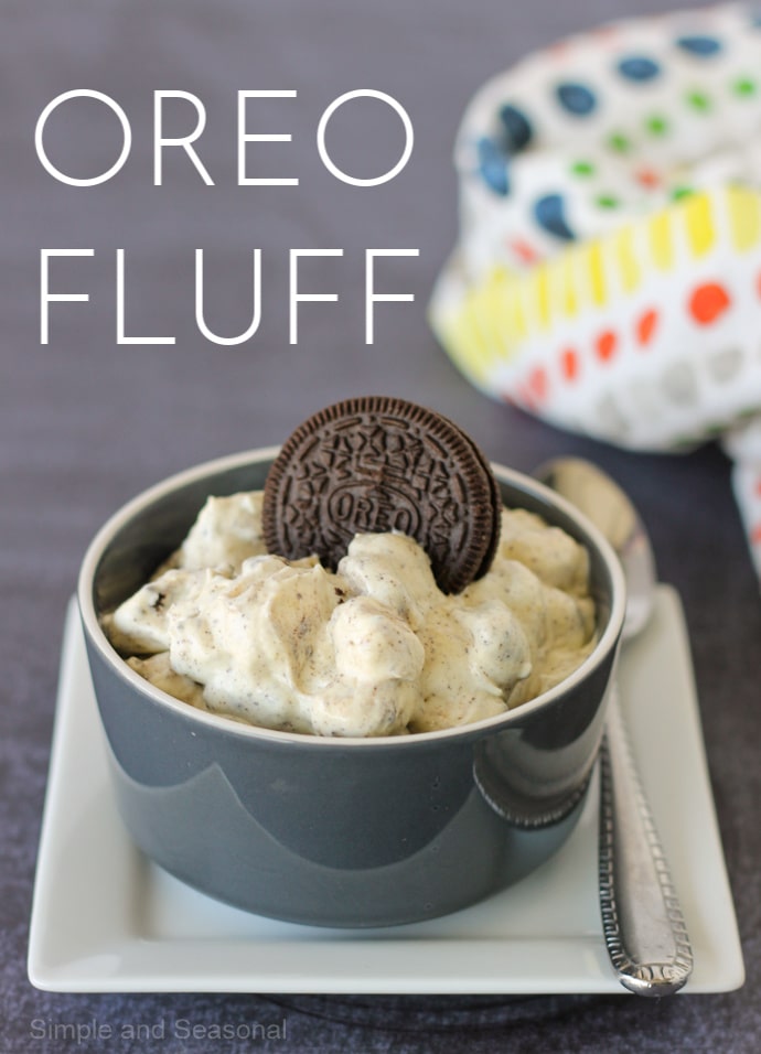 image labeled Oreo Fluff with gray bowl filled with dessert fluff and topped with an Oreo cookie