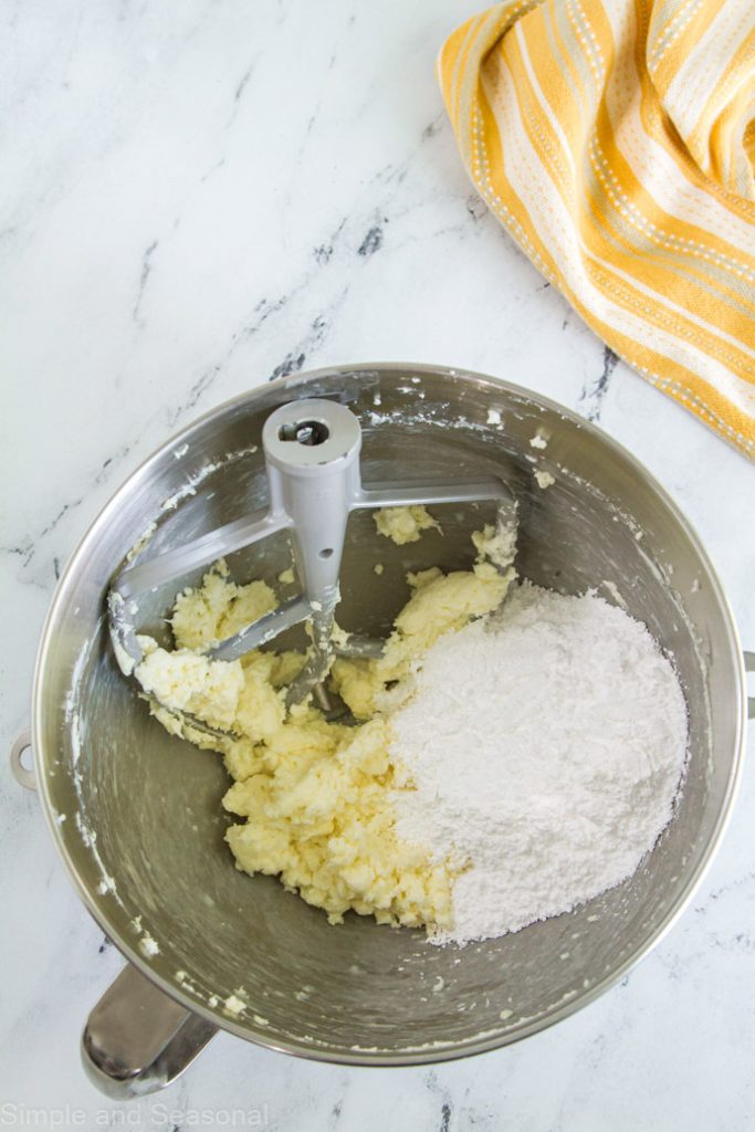butter, cream cheese and powdered sugar in a mixing bowl