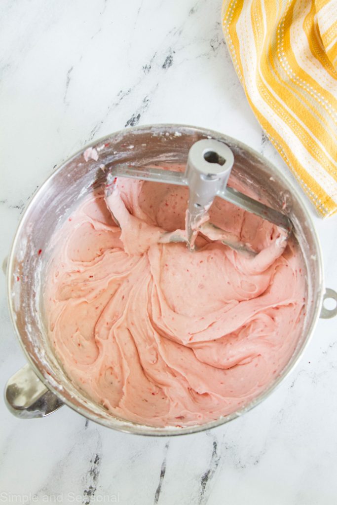 strawberry frosting in a mixing bowl