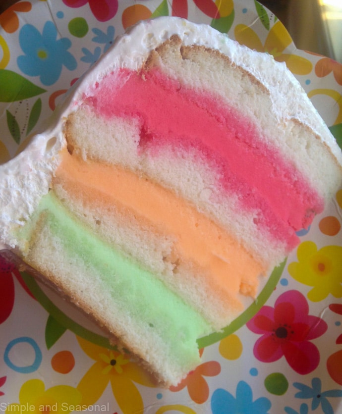 slice of white cake with 3 layers of sherbet