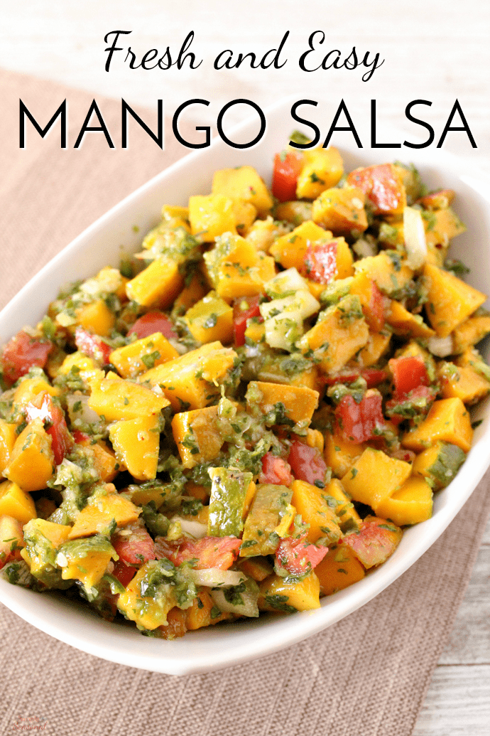 Fresh and easy, this Mango Salsa is perfect for dipping or as a topping on fish and chicken! Make it along with other easy luau recipes and ideas for the perfect backyard party this summer! #Salsa #Luau #Summer #Appetizer via @nmburk
