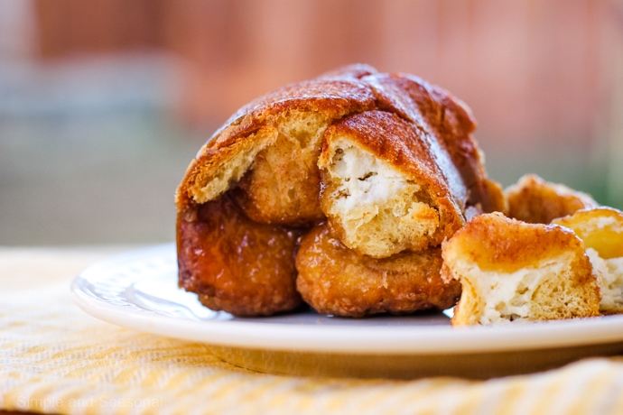 cream cheese stuffed monkey bread on a plate