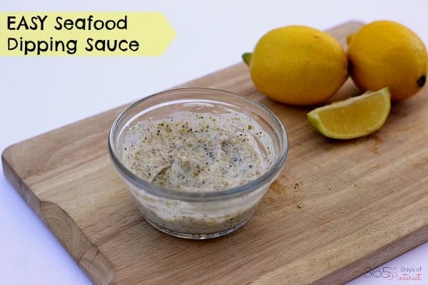 tartar sauce in a bowl with lemons in the background; text reads: easy seafood dipping sauce