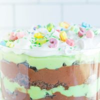 trifle topped with whipped cream and lucky charms cereal