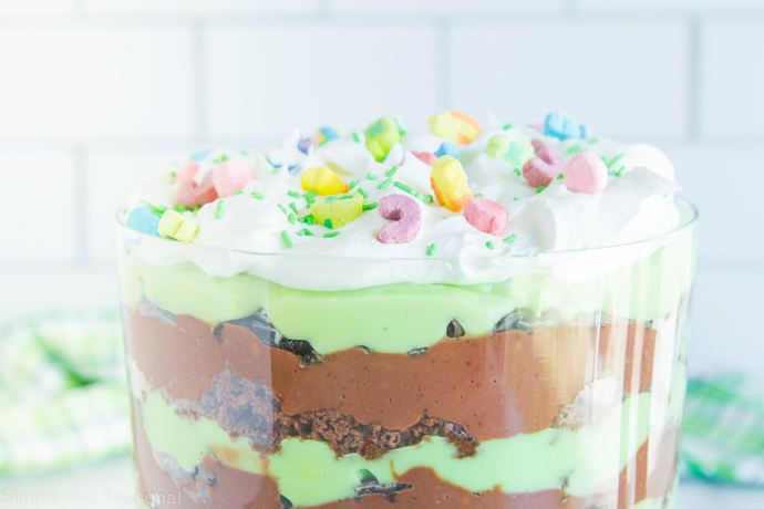 trifle topped with whipped cream and lucky charms cereal