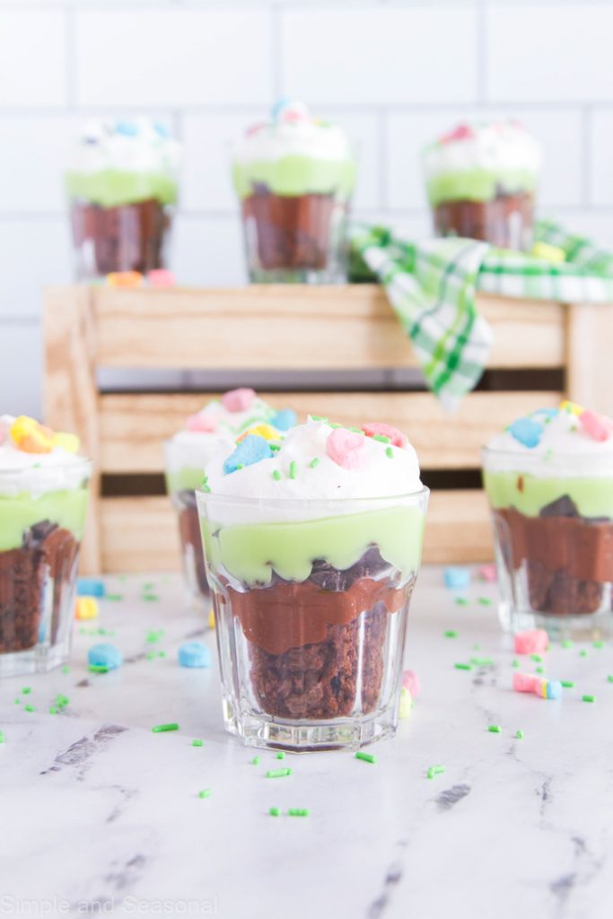 shot glasses filled with mint brownie trifle