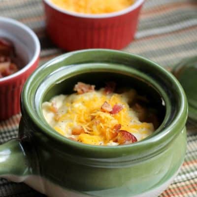 closeup of potato soup topped with cheese and bacon