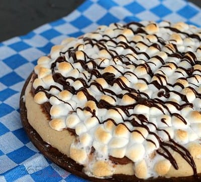 Using a graham cracker pizza crust, make this delicious s'mores dessert pizza for pizza night this week!