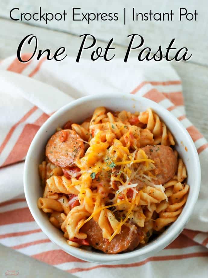 top down view of bowl of cooked pasta with sausage; text overlay reads Crockpot Express| Instant Pot One Pot Pasta