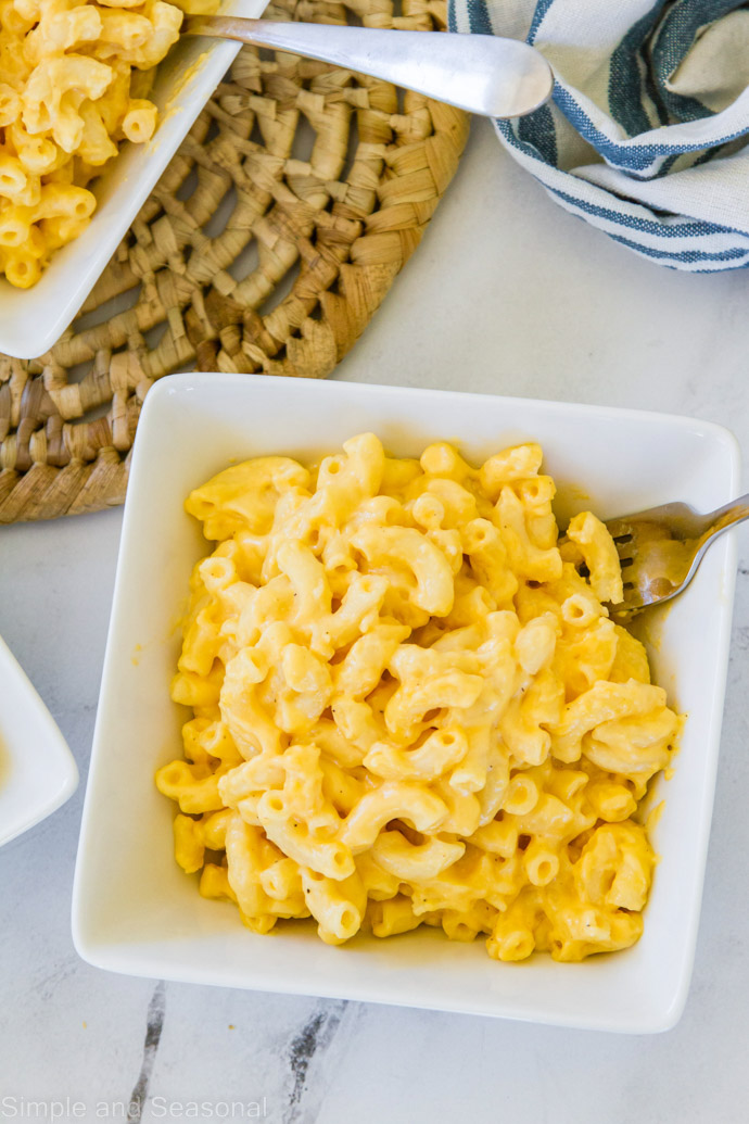 macaroni and cheese in bowls on the table