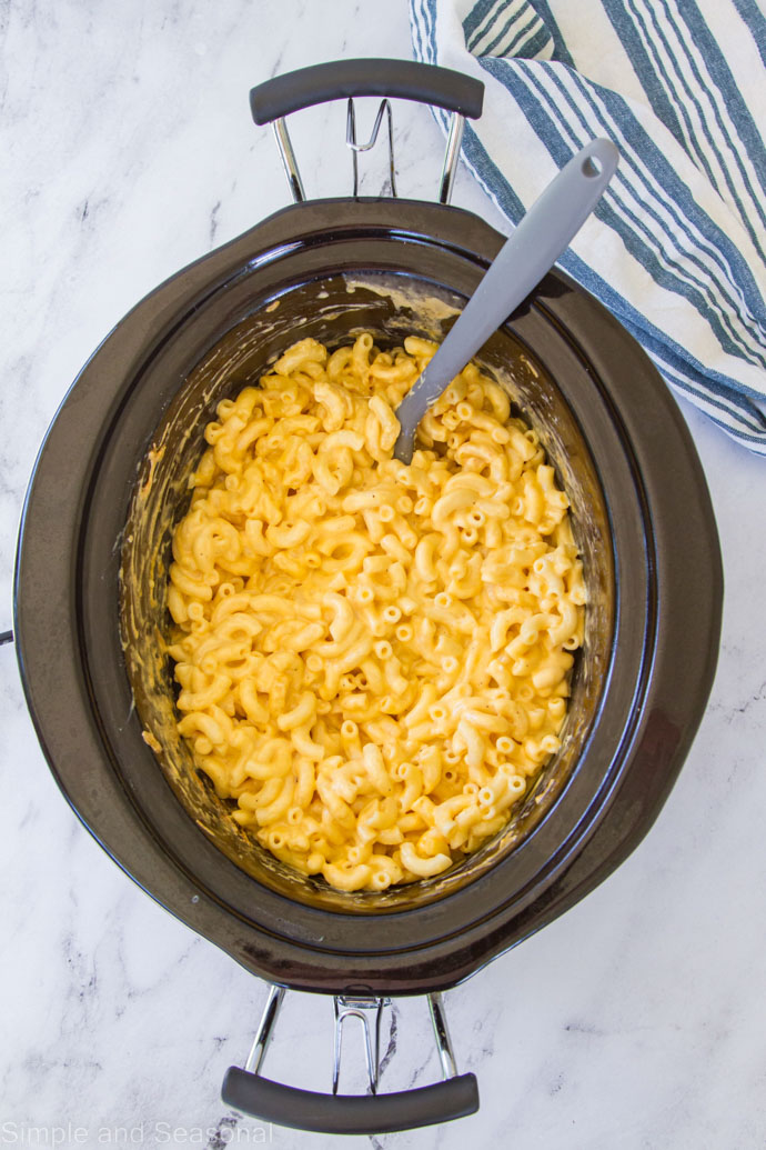 cooked slow cooker mac and cheese in the black crock