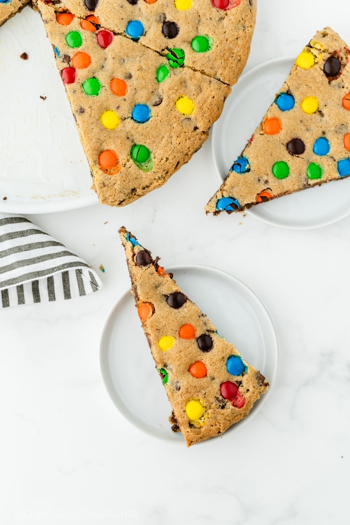 top down view of slices of cookie cake on white plates