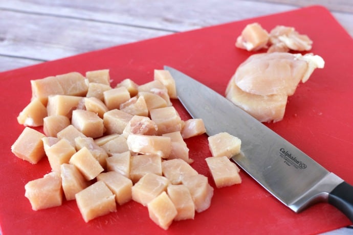 cubed chicken breast and chef knife