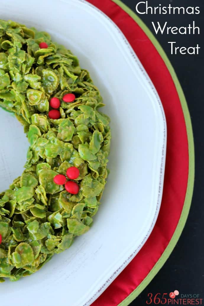 A gooey, sweet and delicious treat that's perfect for Christmas parties, this Christmas Cornflakes Wreath comes together in less than 10 minutes! via @nmburk