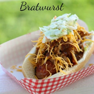 Try something different for your next BBQ and make BBQ pulled pork bratwurst instead of a boring hot dog! The crunchy slaw pulls it all together!