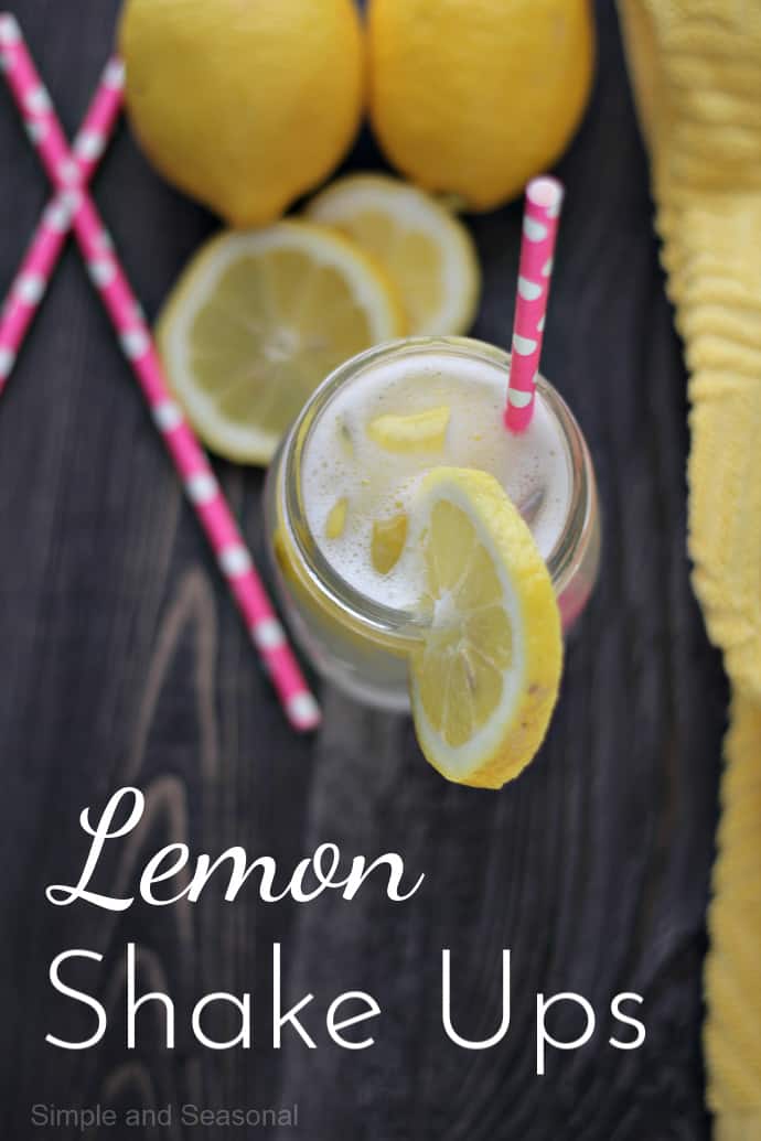 top down view of a jar pink straw and sliced lemon; text label reads Lemon Shake Ups