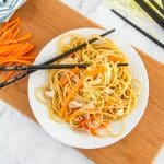 plate of easy chicken lo mein with chopsticks