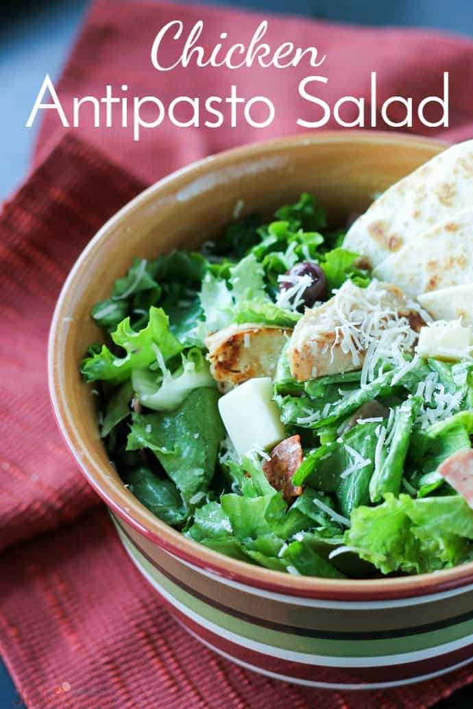 Beat lunchtime boredom with this Chicken Antipasto Salad that's packed with protein, cheese and flavor-packed veggies or serve it with pizza for an awesome weeknight dinner! via @nmburk