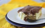 This S’mores Eclair Cake is an easy no bake dessert. It tastes just like an eclair or a Boston cream donut. Make it ahead for an easy potluck dessert!