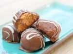 Stuffed with peanut butter cup candies and dipped in creamy milk chocolate, these easy Chocolate Peanut Butter Truffles are sure to become a family favorite!