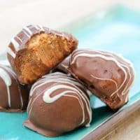 Stuffed with peanut butter cup candies and dipped in creamy milk chocolate, these easy Chocolate Peanut Butter Truffles are sure to become a family favorite!