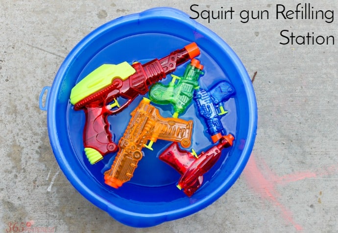squirt gun refills in a blue bucket