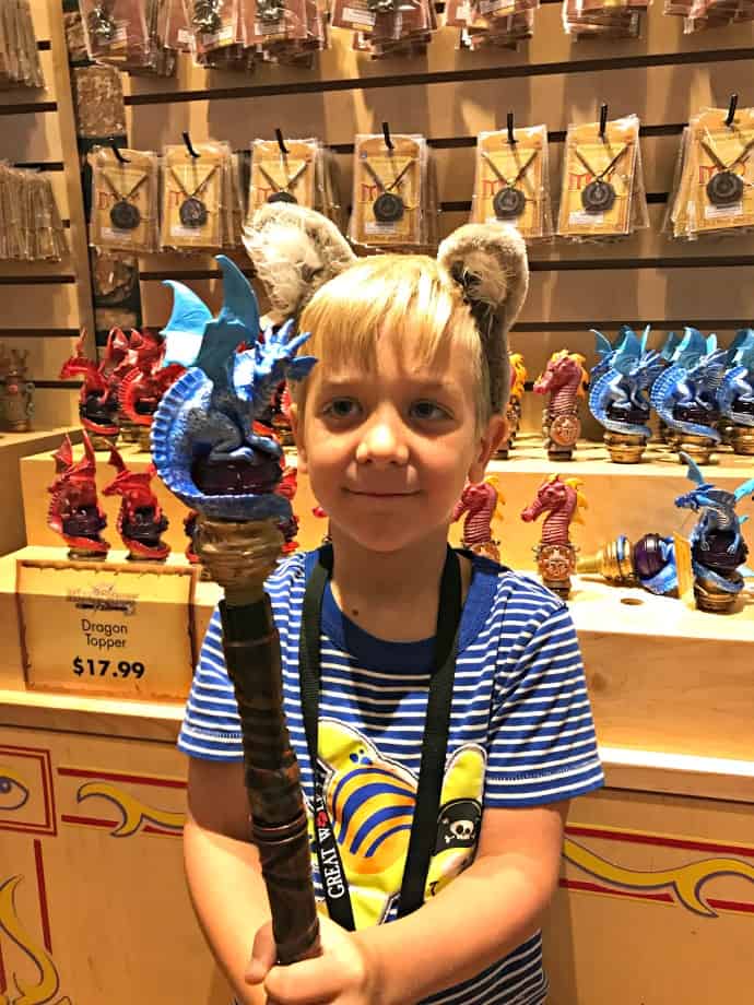 boy holding magic wand and wearing wolf ears