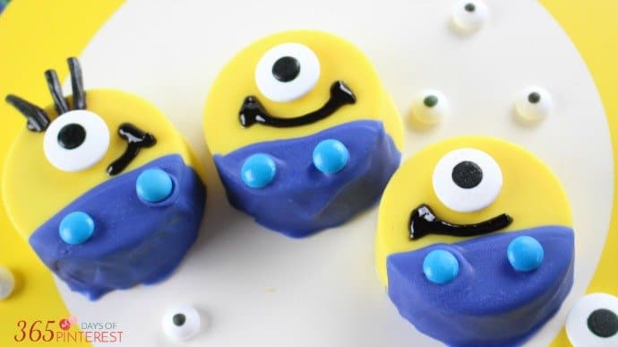 3 Minions made with dipped Oreo cookies and candy
