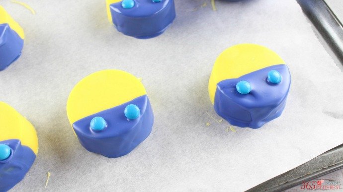 Yellow and blue dipped oreos with candy buttons 