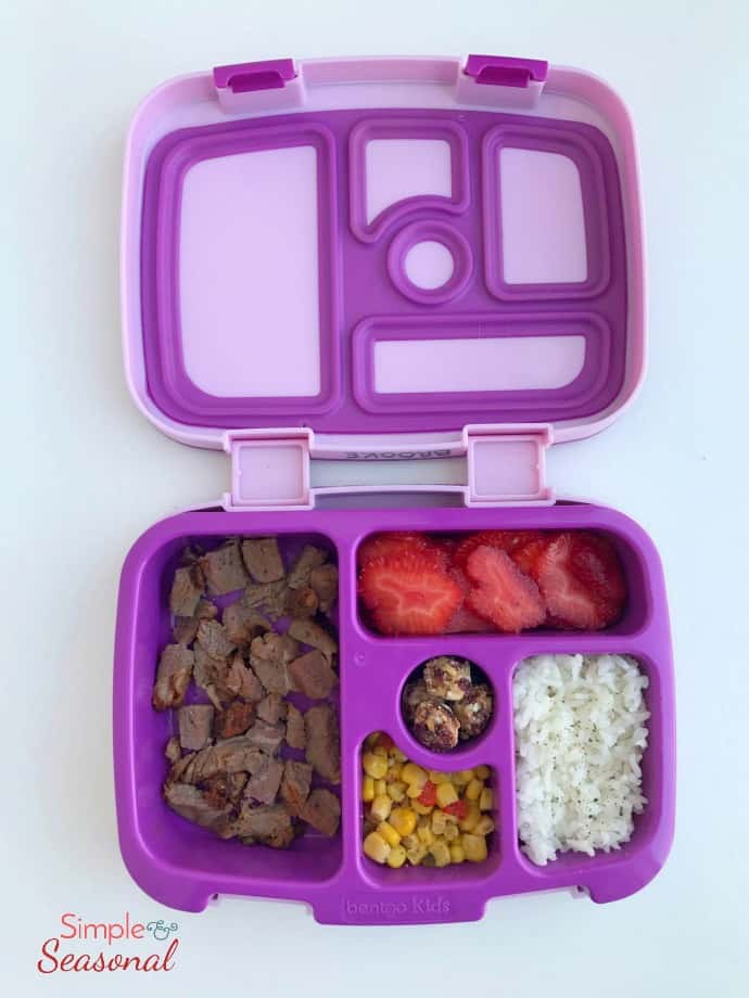 dinner leftovers: roast, corn, rice and fruit in lunchbox