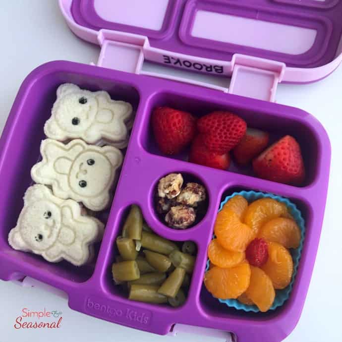 bear shaped sandwiches, mandarins, strawberries, beans and nuts