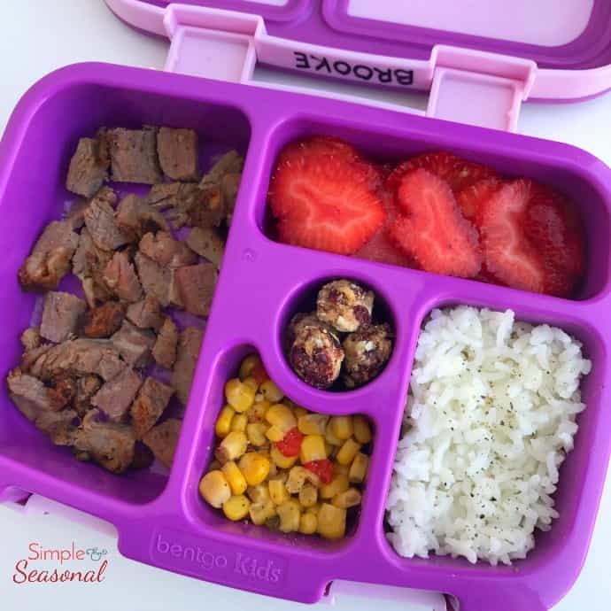 dinner leftovers: roast, corn, rice and fruit in lunchbox