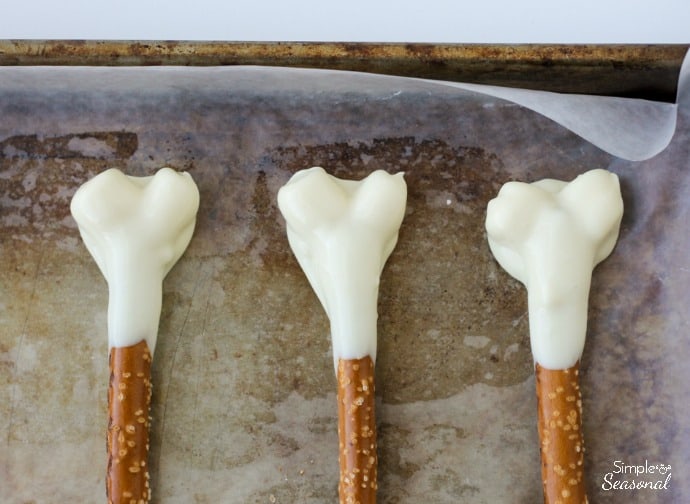 marshmallows covered in more melting candy to look like the top of a leg bone