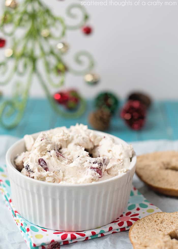 whipped cream cheese with cranberries in a white bowl