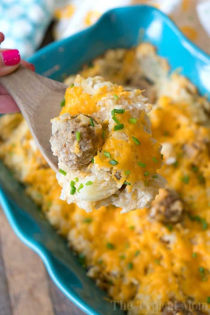spoonful of hashbrown casserole with chunk of sausage