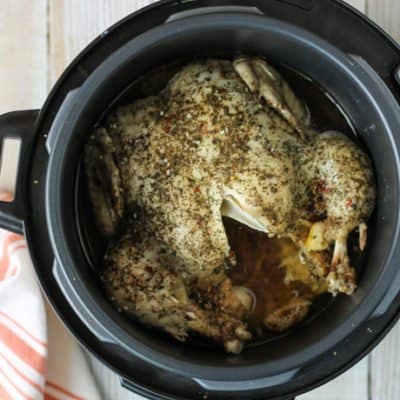 top down view of whole chicken cooked in a Crockpot Express