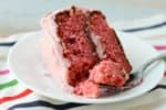 With real strawberries in the cake and the frosting, this Easy Strawberry Cake is perfect for Valentine's Day, Easter or any special celebration! The homemade frosting is good enough to eat with a spoon (and it tastes like a strawberry milkshake.)