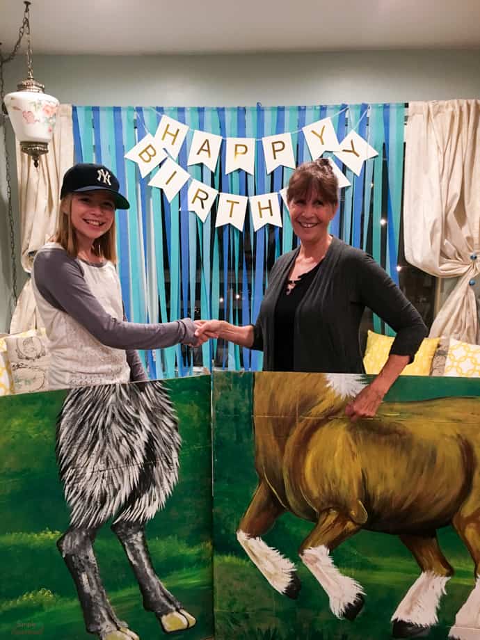 woman and girl posing in satyr and centaur photo booth