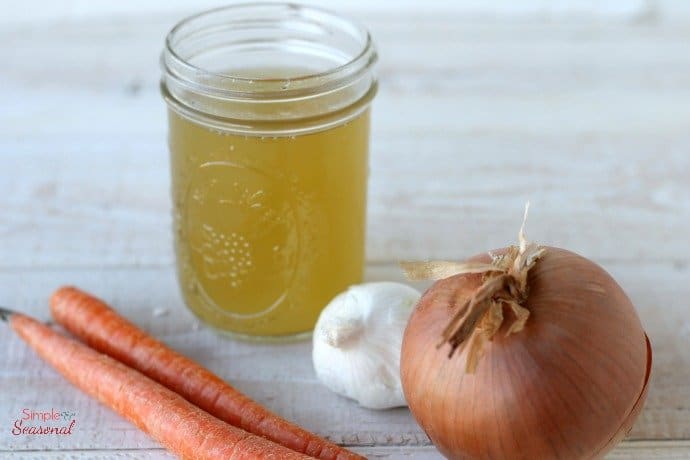 crockpot express chicken broth ingredients: carrots, onions and garlic