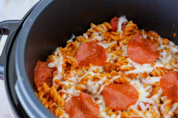 Crockpot Express Pizza Pasta is a family friendly dinner that you can easily adjust with your own favorite pizza toppings! Serve with breadsticks and salad for a satisfying and delicious dinner.
