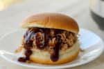 Cook meat for BBQ sandwiches, nachos, quesadillas or even pizza in a fraction of the time with this Crockpot Express Pulled Pork recipe!